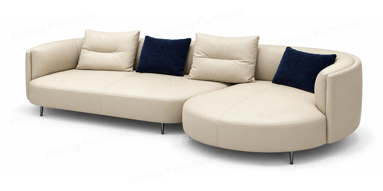 Angled view of the cream leather sofa showing its rounded chaise, curved arm and slim dark legs