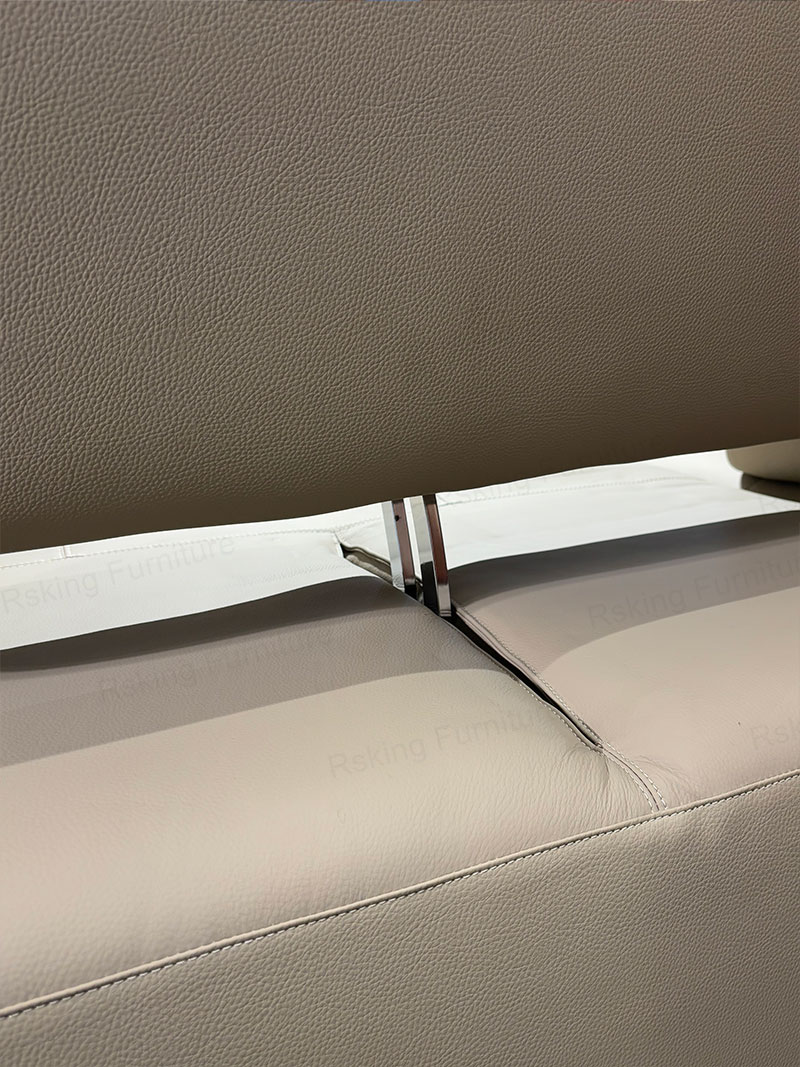 Metal support beneath the cream leather backrest of the Rsking RSK13-B sofa
