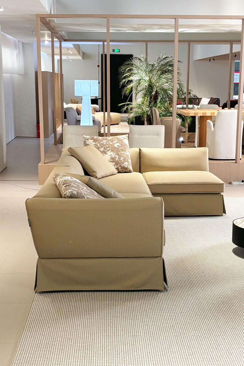 Side view of the Rsking RSK2606 showing its low back, upholstered arm and skirted base