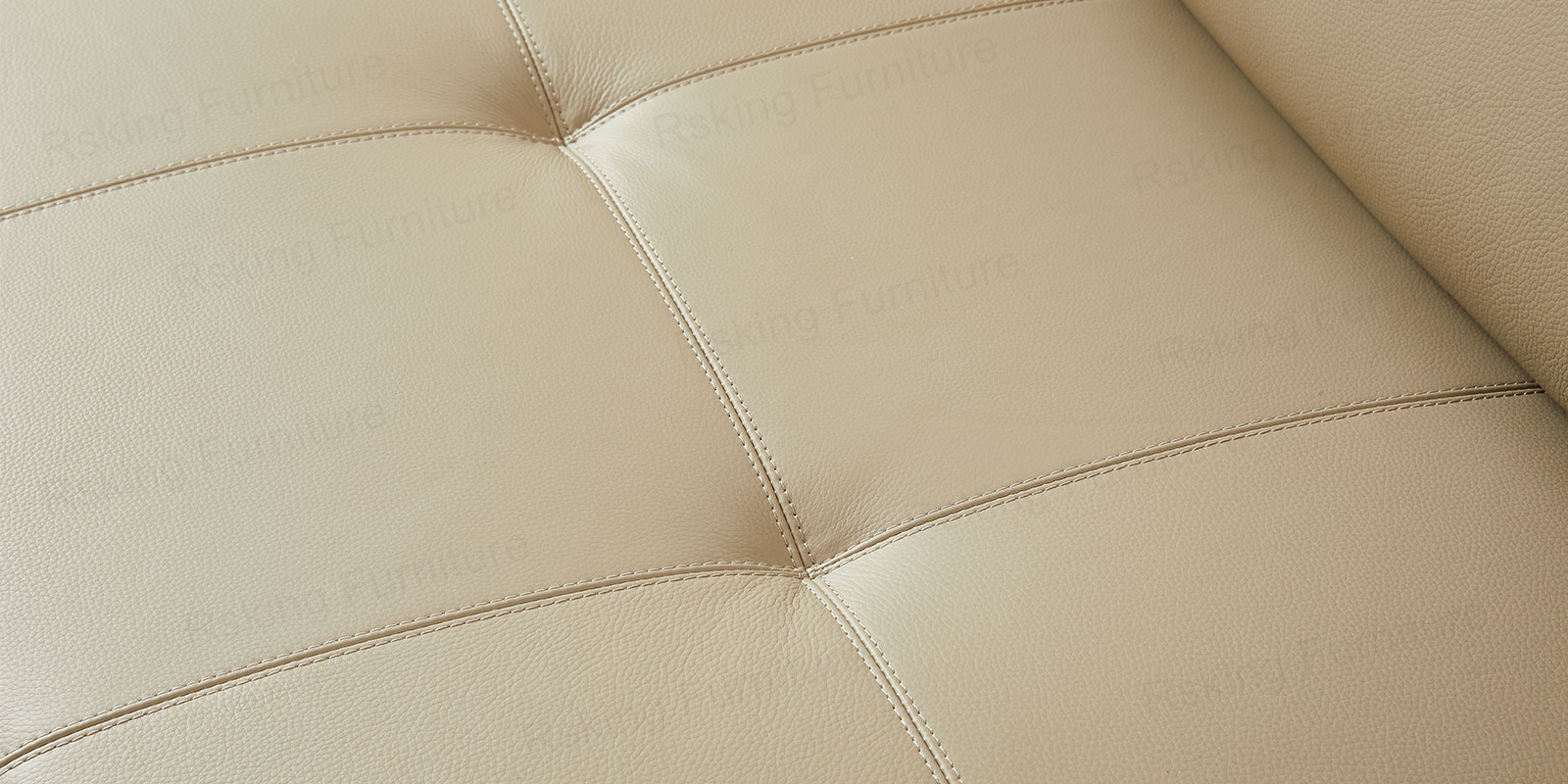 Close-up of the Rsking RSK13-B cream-beige leather seat showing textured grain and grid stitching