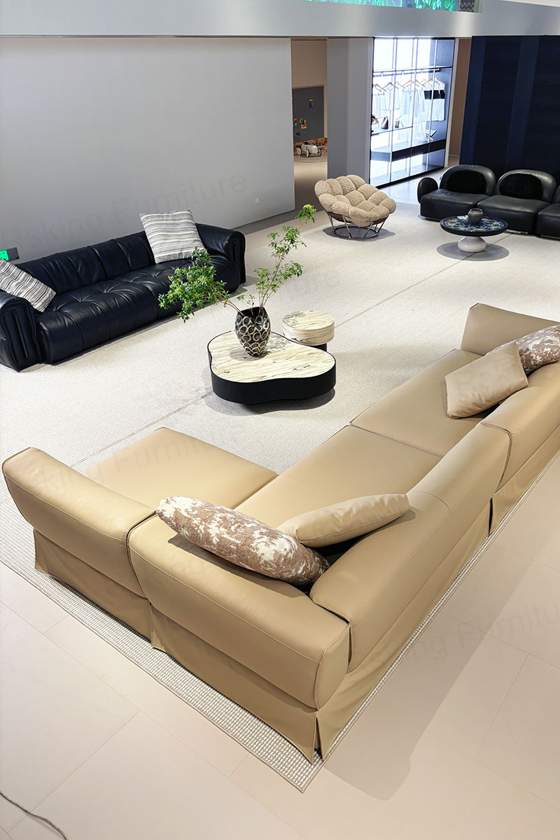 Elevated rear view of the Rsking RSK2606 beige leather sectional and armless seat in the showroom
