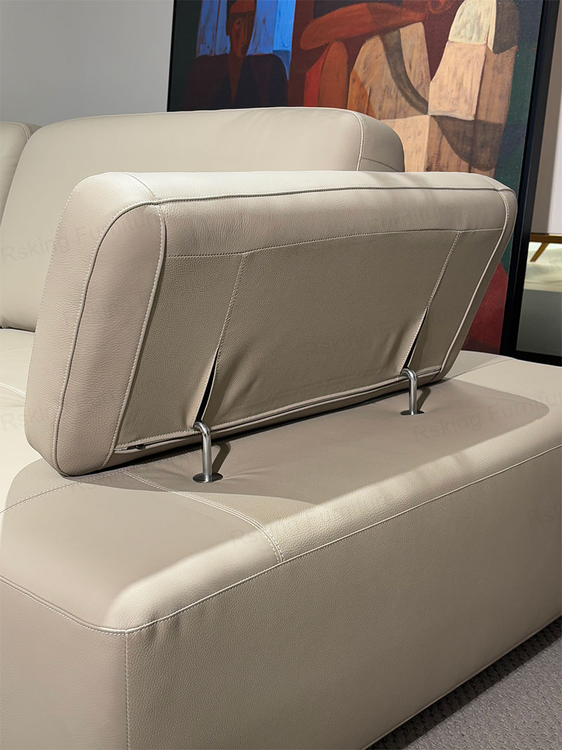 Raised armrest with stitched leather edges and visible metal supports on the Rsking RSK13-B sofa