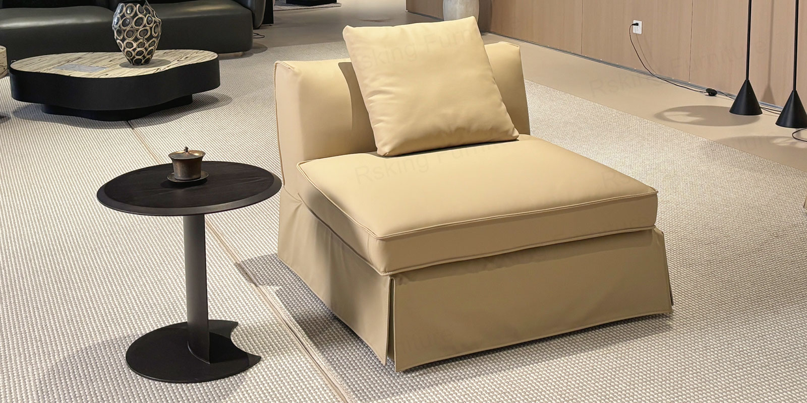 Separate armless single-seat unit of the Rsking RSK2606 with a beige cushion and skirted base